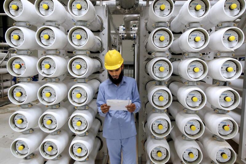 A worker inspects operations at in Riyadh's Ras Al Khair desalination plant, the largest in the world. Fahed Shadeed / Reuters