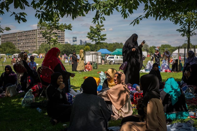 LONDON, ENGLAND - JULY 06:  Women picnic as they celebrate the festival of Eid at Southwark Eid Festival in Burgess Park on July 6, 2016 in London, England. Thousands gathered at Southwark Eid Festival in Burgess Park to celebrate the Muslim holiday of Eid which marks the end of 30 days of dawn-to-sunset fasting during the holy month of Ramadan.  (Photo by Rob Stothard/Getty Images)
