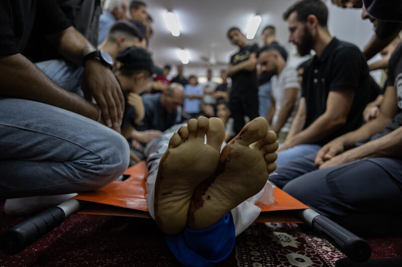 The community in Jenin refugee camp prepare to bury one of the men killed in the Israeli raid of November 2-3