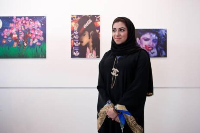 DUBAI, UAE (18/04/2011) Reem Abdalla stands next to her artwork at the Dar Ibn Haytham Art Gallery at the Bastakiyah, Dubai. The gallery is showcasing artwork by Emirati artists. (Callaghan Walsh / for The National)