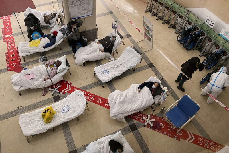 Covid-19 patients in the lobby of the Chongqing No 5 People's Hospital in China's south-western city of Chongqing. AFP