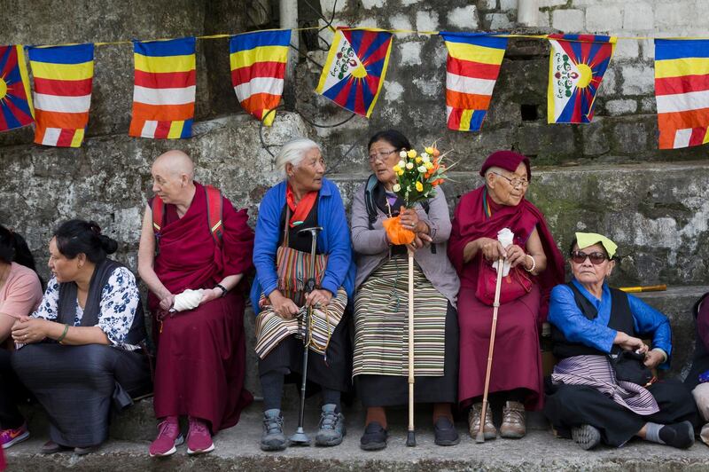 Exiled Tibetans wait to welcome their spiritual leader the Dalai Lama in Dharmsala, India. AP Photo