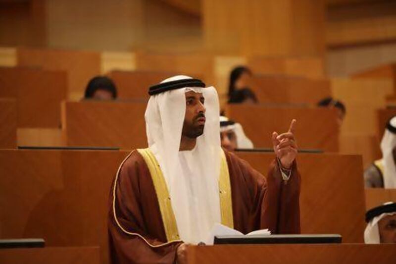 Dr Mohamed bin Ham, an FNC member from Abu Dhabi, questions Obaid Al Tayer, the Minister of State for Finance, on the delay in enacting the pension law that would benefit the Emiratis. Fatima Al Marzooqi / The National