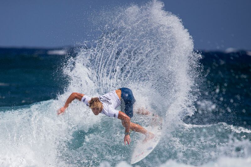 Canada's Cody Young catches a wave at the ISA World Surfing Games, off La Marginal beach in Arecibo, Puerto Rico. AFP 