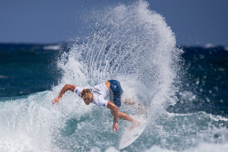 Canada's Cody Young catches a wave at the ISA World Surfing Games, off La Marginal beach in Arecibo, Puerto Rico. AFP 