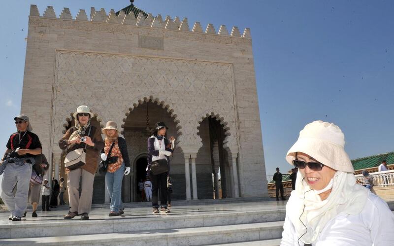 Tourists visit the Mausoleum of Mohamed V in Rabat on July 24, 2012. The economic crisis in Europe has affected the tourism sector in Morocco. AFP PHOTO/FADEL SENNA .