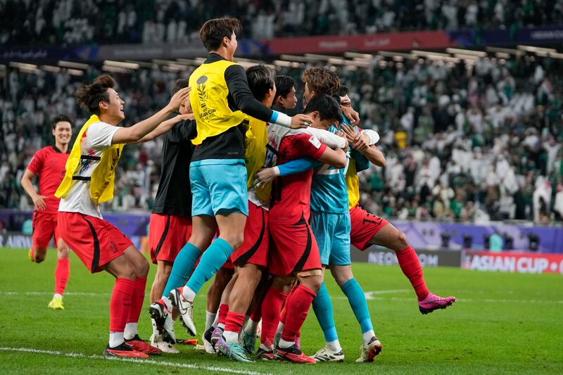 South Korea's players celebrate after the winning penalty in the shootout. AP