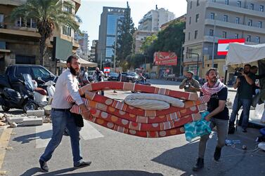 Protesters remove mattresses in Beirut, Lebanon October 30, 2019. REUTERS/Mohamed Azakir