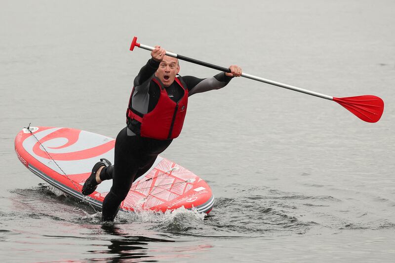 British leader of the Liberal Democrats party Ed Davey falls from a paddle board, at Lake Windermere in Windermere, Britain, May 28, 2024.  REUTERS / Phil Noble     TPX IMAGES OF THE DAY
