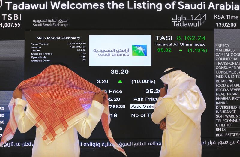 Saudi market officials monitor Aramco's share price on the kingdom's stock exchange. AP