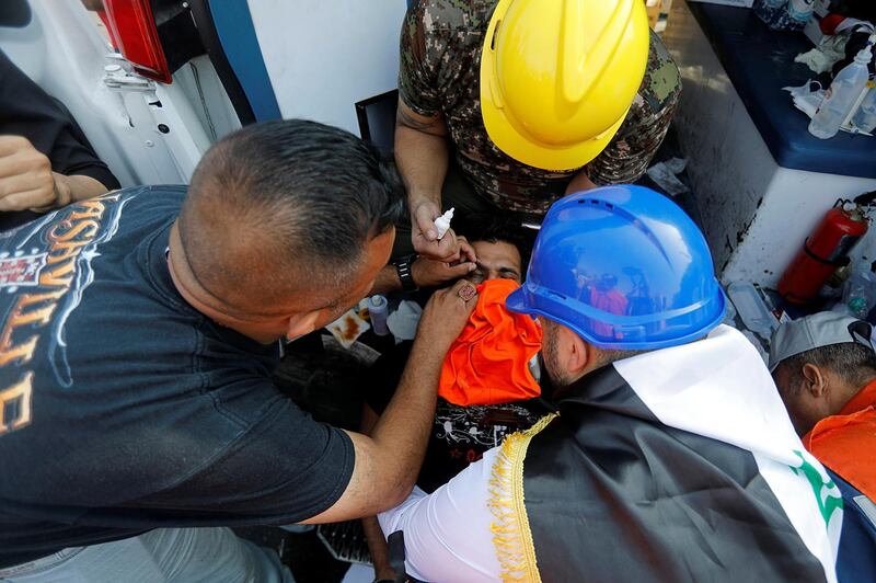 A demonstrator affected by tear gas is treated in Baghdad. Reuters