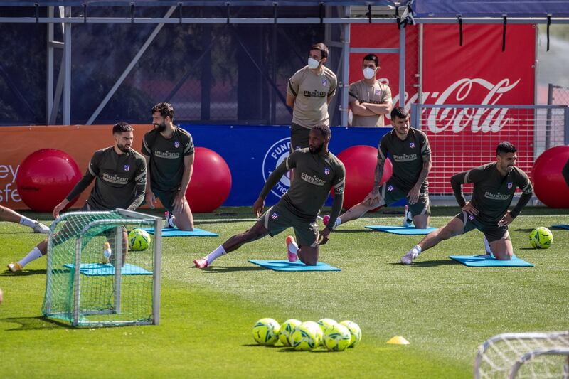 Atletico Madrid's Yannick Carrasco, Moussa Dembele, and Luis Suarez dirong their team's training session at Sports City in Majadahonda on Thursday. EPA