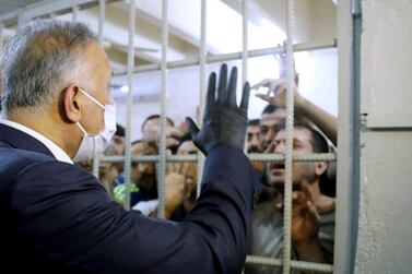 Iraqi Prime Minister Mustafa Al Kadhimi talks to prisoners during his visit in the central investigation prison in Al Muthana airport in Baghdad, Iraq July 30, 2020. Reuters