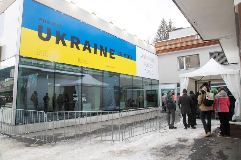 Visitors queue outside Ukraine's pavilion in Davos. Reuters