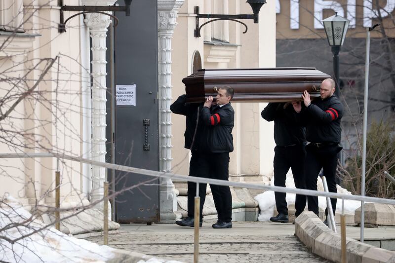 The coffin is carried inside the church. Mr Navalny's family had struggled to find anywhere willing to hold his funeral. EPA