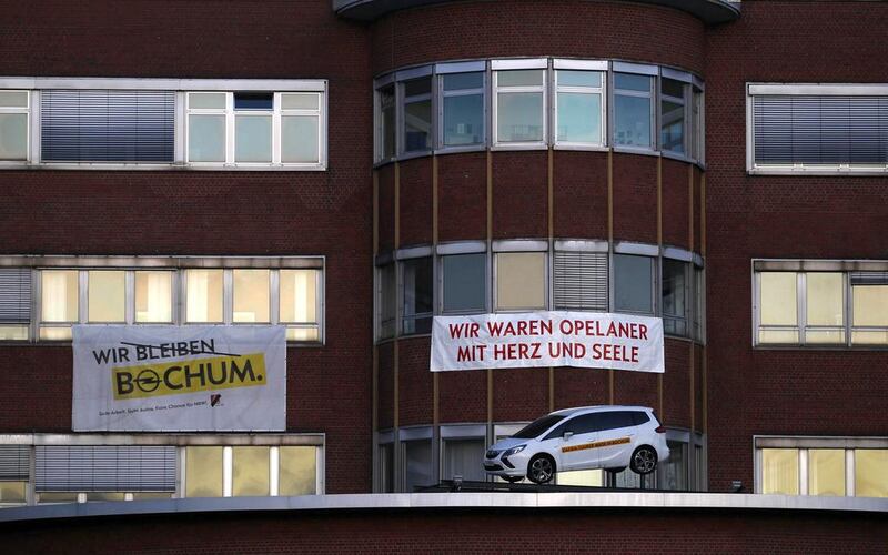 A banner “we were Opel employees with heart and soul” is seen in front of the Opel plant in Bochum. Ina Fassbender / Reuters