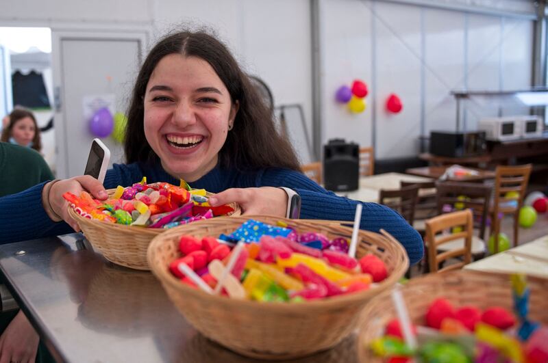 Ukranian refugee Karolina, 16, laughs as she prepares for a party at the La Ville-aux-Dames camp site, her family's temporary home in La Ville-aux-Dames, central France. AFP