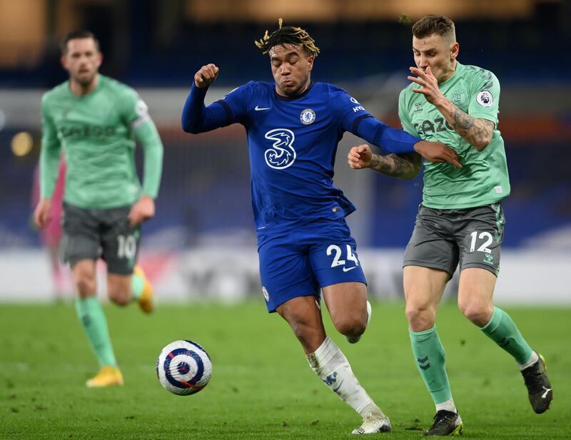 LONDON, ENGLAND - MARCH 08: Reece James of Chelsea is challenged by Lucas Digne of Everton during the Premier League match between Chelsea and Everton at Stamford Bridge on March 08, 2021 in London, England. Sporting stadiums around the UK remain under strict restrictions due to the Coronavirus Pandemic as Government social distancing laws prohibit fans inside venues resulting in games being played behind closed doors. (Photo by Mike Hewitt/Getty Images)