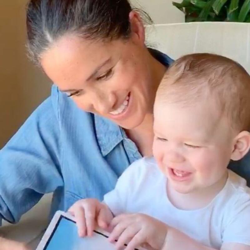 Meghan, Duchess of Sussex, reads to baby Archie in a video released to mark his first birthday. Instagram / Save the Children