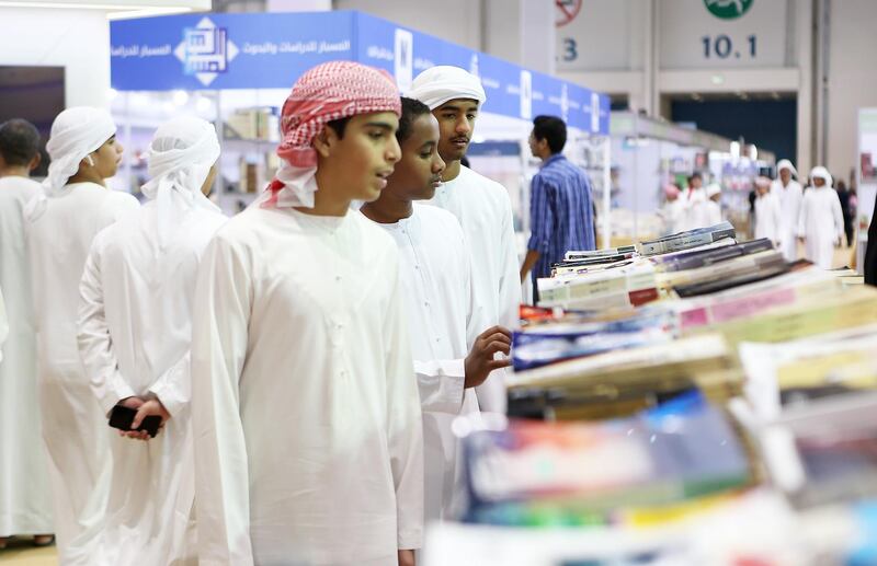 ABU DHABI , UNITED ARAB EMIRATES – May 2 , 2017 : School students looking books at different book stalls during the Abu Dhabi International Book Fair held at Abu Dhabi National Exhibition Centre in Abu Dhabi.  ( Pawan Singh / The National ) For News. Story by Roberta Pennington. ID : 54280 *** Local Caption ***  PS0205- BOOK FAIR24.jpg