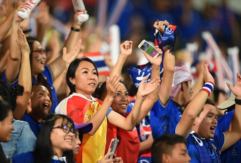 Supporters of Thailand cheer during the 2018 World Cup qualifying match against UAE in Abu Dhabi. Tom Dulat / Getty Images