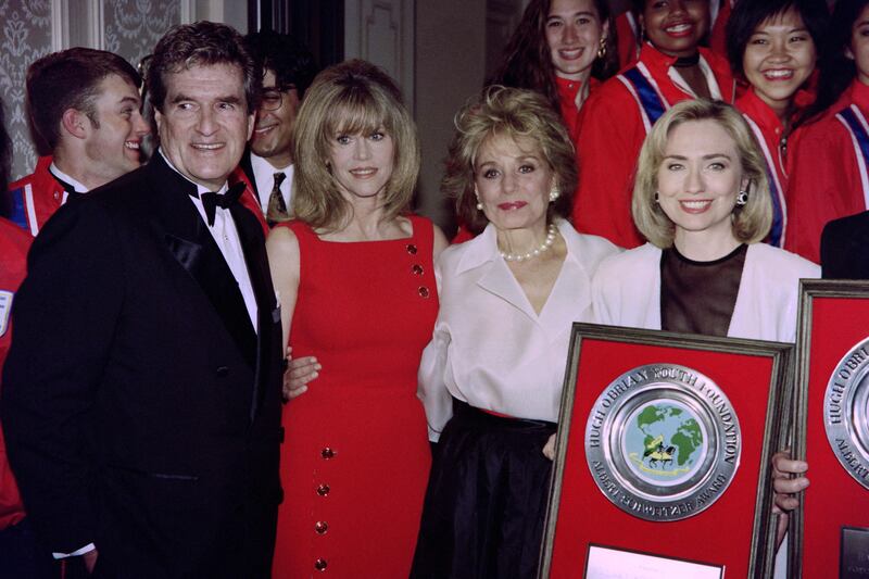 Jane Fonda, in red, with former US first lady Hillary Clinton, Hugh O'Brian and Barbara Walters in New York on May 10, 1993
