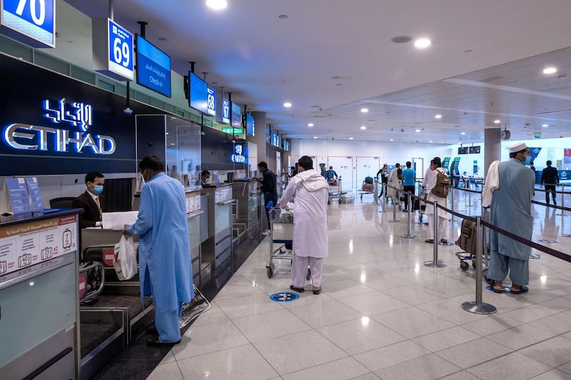 Abu Dhabi, United Arab Emirates, July 8, 2020.   Abu Dhabi International Airport Media Tour by Etihad.  Passengers at the Etihad Check-In area.Victor Besa  / The NationalSection:  NA Reporter: