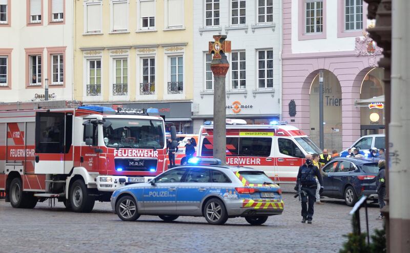 A square is blocked by the police in Trier, Germany, Tuesday, Dec. 1, 2020.  German police say two people have been killed and several others injured in the southwestern German city of Trier when a car drove into a pedestrian zone. Trier police tweeted that the driver had been arrested and the vehicle impounded. (Harald Tittel/dpa via AP)