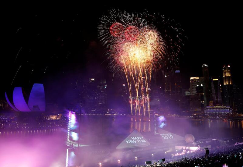 Fireworks explode over the Marina Bay for the New Year celebrations in Singapore. Reuters