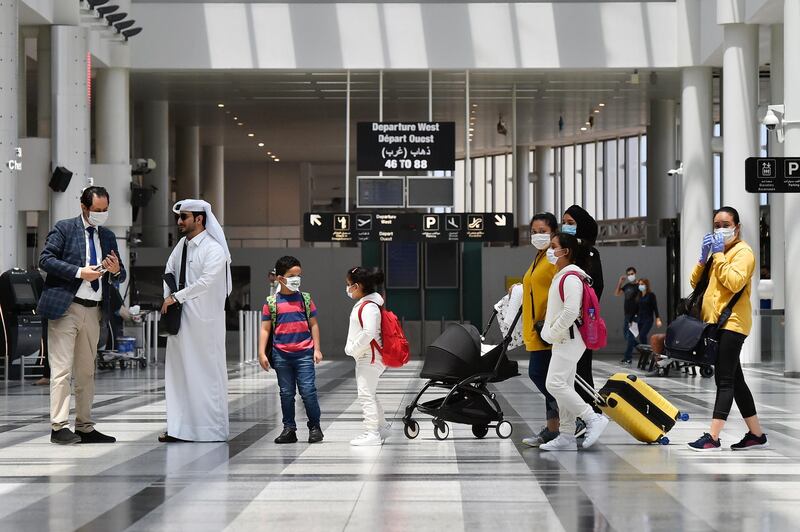 People wearing protective face masks against Covid-19 are pictured at the departure terminal of the Rafik Hariri international airport during its re-opening. EPA