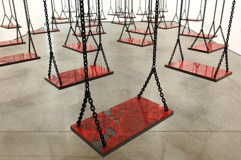 Suspended features an entire room of swings bearing street maps of 35 cities. Courtesy H Glendinning /Mathaf


