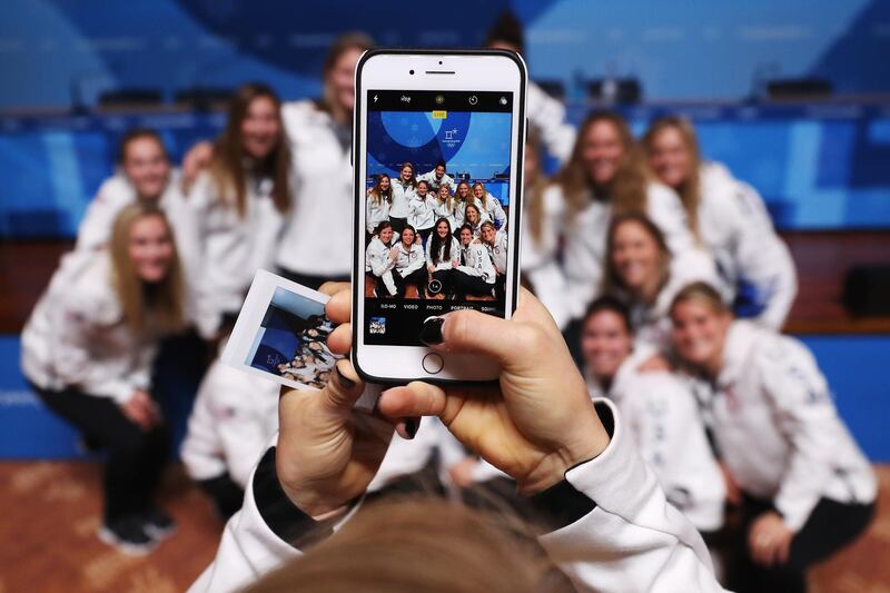 Amanda Kessel takes a picture of her United States Women's Ice Hockey team mates while they attend a press conference at the Main Press Centre during previews ahead of the PyeongChang 2018 Winter Olympic Games. Ker Robertson / Getty Images