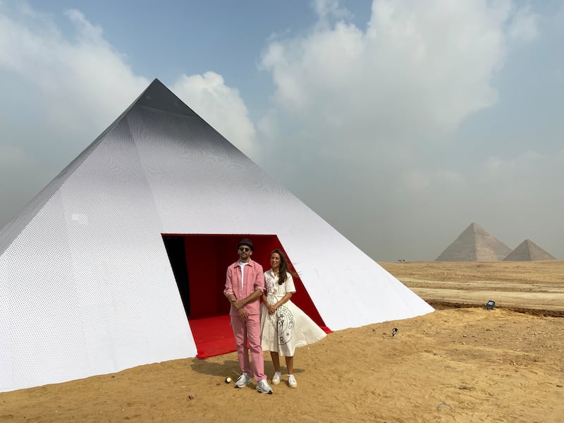 Art d'Egypte founder Nadine Abdel Ghaffar with French artist JR at interactive photo booth Inside Out Giza. Nada El Sawy / The National