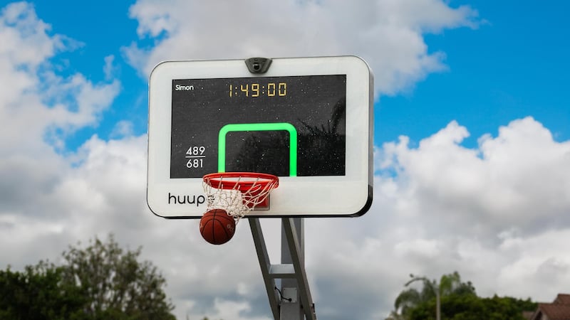 The Huupe is a smart basketball hoop that uses AI to track performance, with an option to challenge other players remotely around the world. Photo: Huupe
