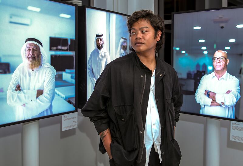 Filipino photographer Augustine Paredes in front of his work. Victor Besa / The National