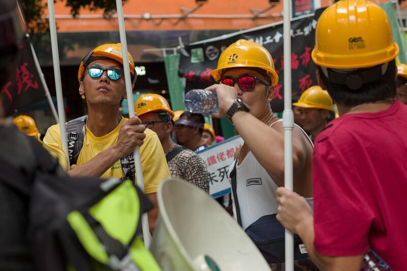 Activists from the construction industry take part in the annual Labor Day march in Hong Kong.  EPA