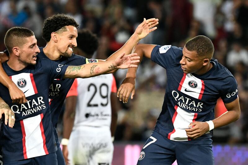 Kylian Mbappe celebrates with teammates after scoring. AFP