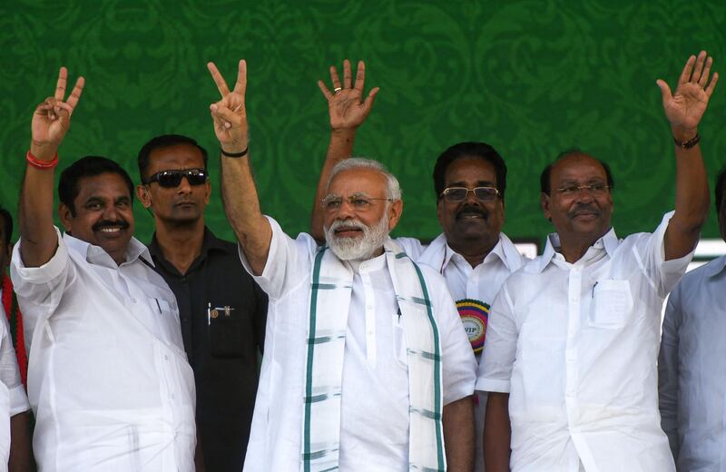 (FILES) In this file photo taken on March 6, 2019 Indian Prime Minister Narendra Modi (C) gestures along with Indian Chief Minister of the state of Tamil Nadu Edappadi Palanisamy (R), Pattali Makkal Katchi (PMK) founder S. Ramadoss (R) and other party leaders during a National Democratic Alliance (NDA) rally in Chennai. India is set to announce March 10 the dates for a national election that will see hundreds of millions of voters cast their ballots in the biggest democratic exercise on earth.
 / AFP / Arun SANKAR
