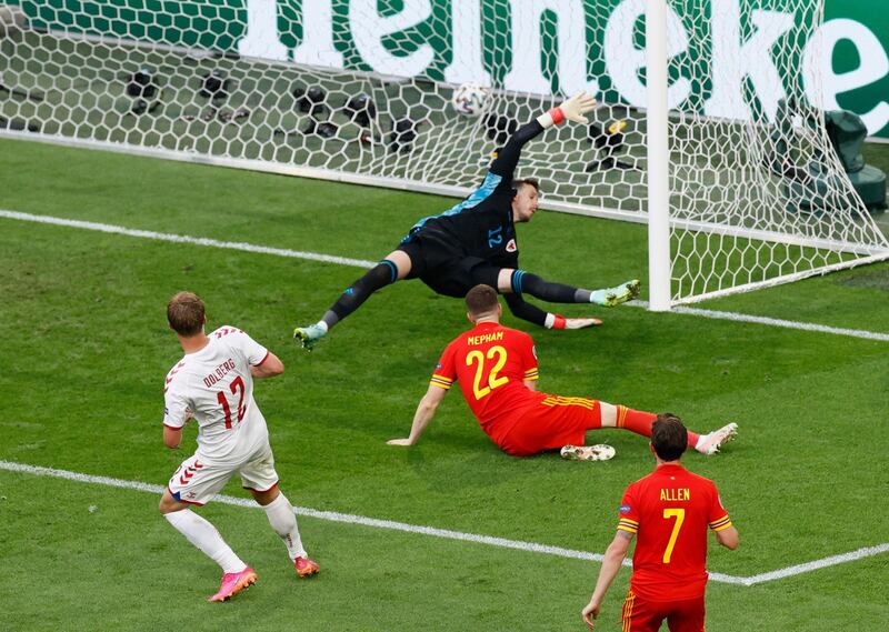 Denmark's Kasper Dolberg scores their second goal on Saturday. Reuters