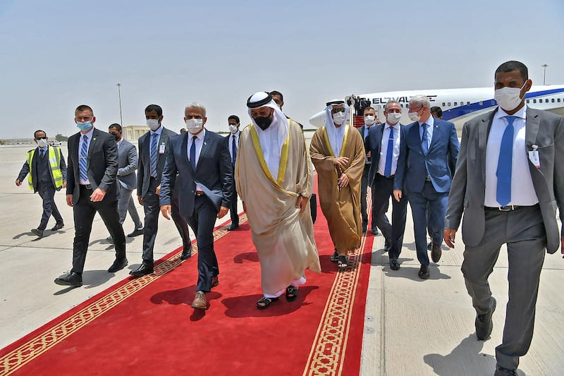 Minister of State Ahmed Al Sayegh receives Israeli Foreign Minister Yair Lapid in Abu Dhabi. AFP