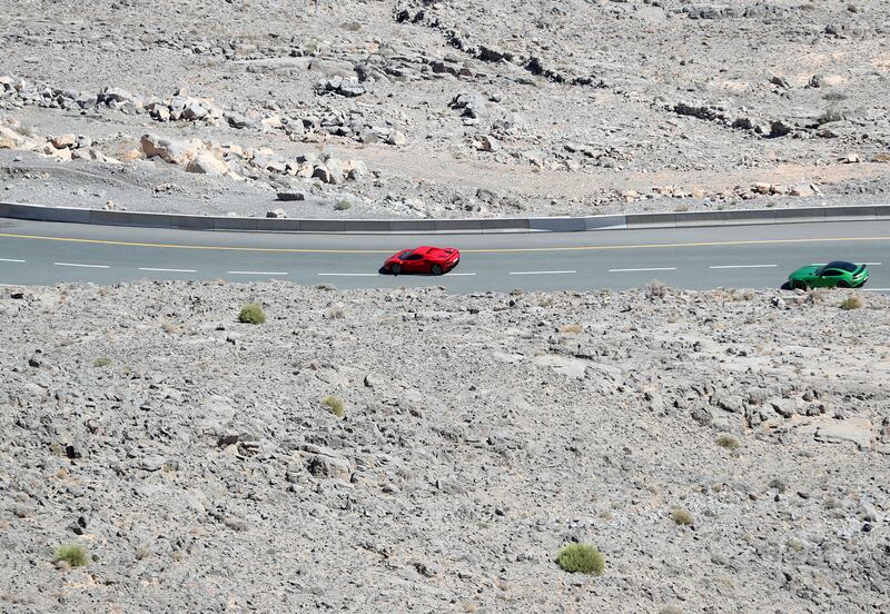 More than 100 supercars, grid cars and celebrity drivers sped through the winding roads as spectators looked on from the Jebel Jais viewing deck