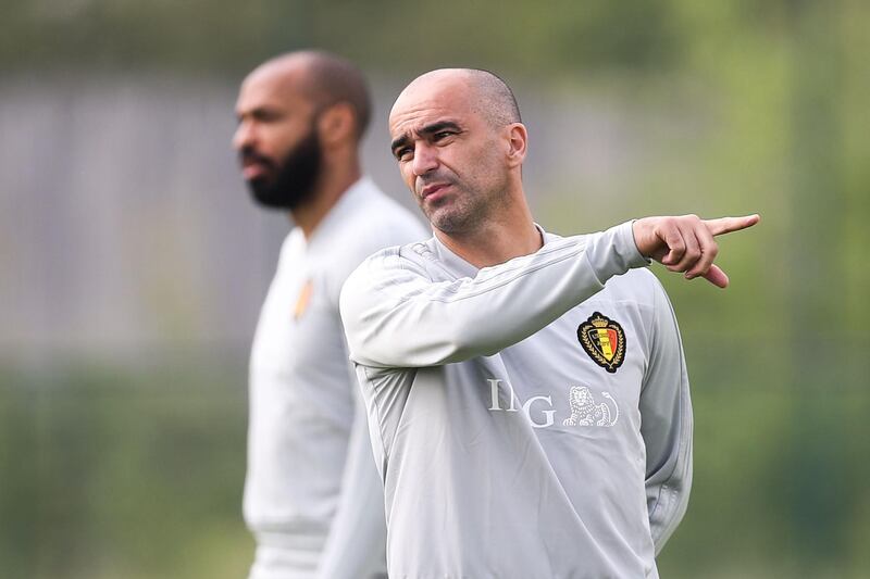 Belgian national football team Red Devils' assistant coach Thierry Henry (L) and head coach Roberto Martinez take part in a training session on May 23, 2018, in Tubize.  At the start of the week, head coach announced the 23 players selected for the upcoming FIFA World Cup 2018 in Russia. - Belgium OUT
 / AFP / Belga / BRUNO FAHY
