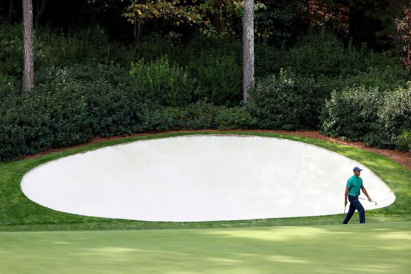 Tiger Woods walks on the 13th green during a practice round prior to the Masters at Augusta National Golf Club. AFP