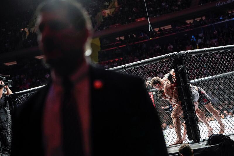 A Secret Service agent maintains watch as US President Donald Trump watches UFC 244. Reuters