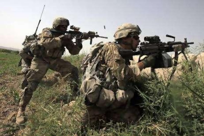 US Army soldiers Sgt Jonathan Garcia (L) and Spc Nathan Horowitz (R) with Alpha Company, 2-508 Parachute Infantry Regiment, 4th Brigade Combat Team, return fire during a gun battle with suspected Taliban militants near the village of Jilga in Arghandab District north of Kandahar July 8, 2010. REUTERS/Bob Strong (AFGHANISTAN - Tags: CONFLICT MILITARY) *** Local Caption ***  RCS01_AFGHANISTAN-_0708_11.JPG