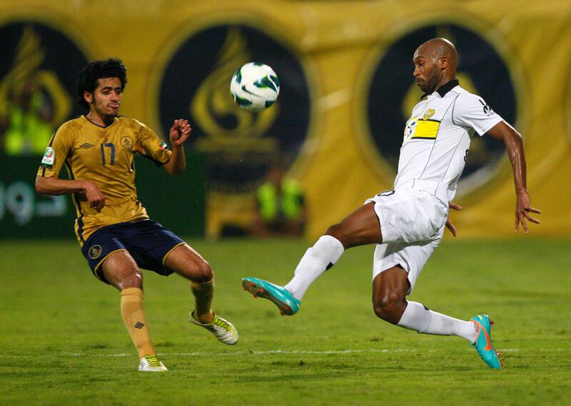 Rami Yaslam of Dubai (left) and Shikabala of Al Wasl fight for the ball during the Etisalat Pro League match between Dubai and Al Wasl at Dubai Sports & Cultural club Stadium, Dubai on the 9th November 2012. Credit: Jake Badger for The National
