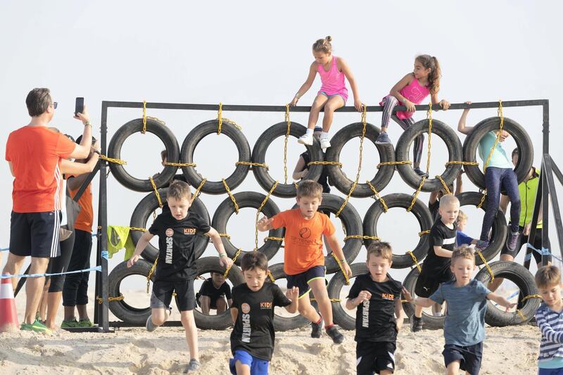 ABU DHABI, UNITED ARAB EMIRATES. 11 OCTOBER 2019. The Tough Mudder sports event held on Hudayriat Island in Abu Dhabi. Kids compete and enjoy the obstacles and challenges on the Mini Mudder course specially designed for children. (Photo: Antonie Robertson/The National) Journalist: None. Section: National.
