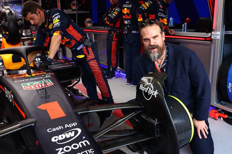 American actor David Harbour next to the car of Max Verstappen in Monaco. Getty