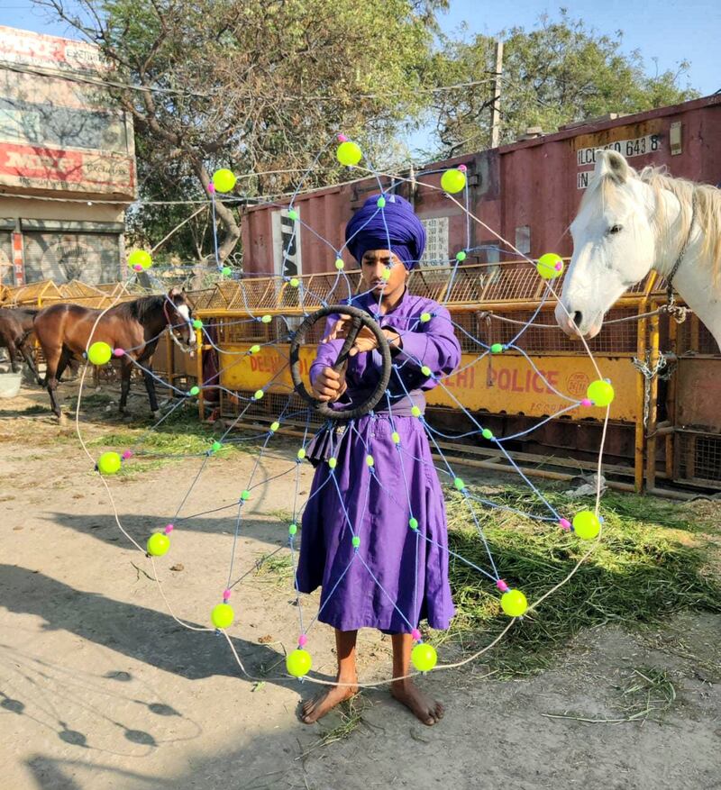 Sartaj Singh, 15, a young Nihang Sikh warrior practicing martial arts at Singhu border, some 15 km away from capital New Delhi where hundreds of thousands of farmers have been camping out since November 26 against controversial farm laws. Taniya Dutta for The National