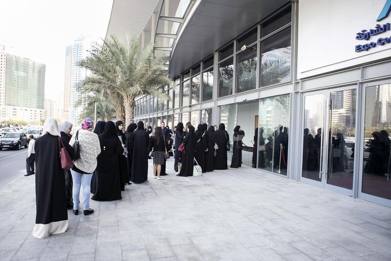 Women queue for security checks outside the National Career Exhibition at Sharjah Expo Centre. Reem Mohammed / The National